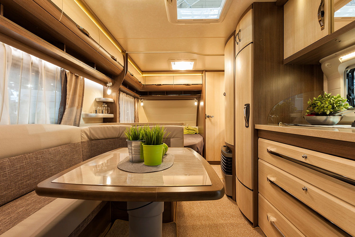 An image of a caravan inside with carpets.