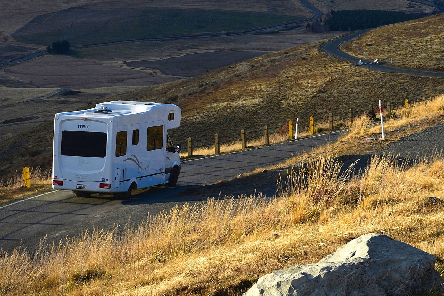 An image of a motorhome on a winding road.